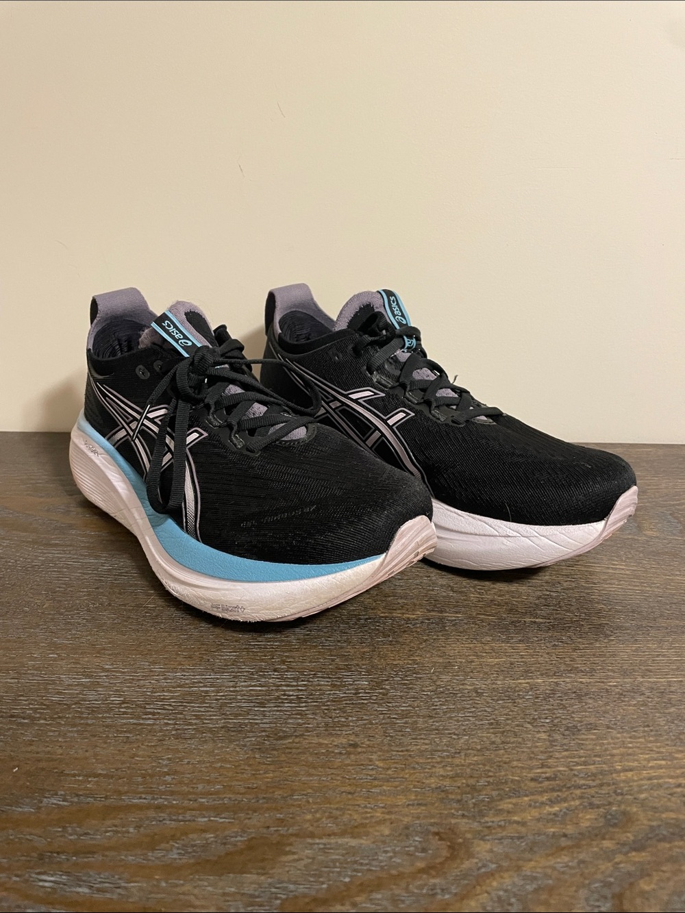 ASICS Gel Nimbus Black Running Shoes with Light Blue Accents